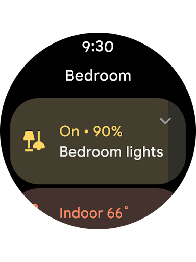 A smartwatch face with Google Home open shows the lights are on in the bedroom.
