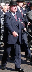 mAN WEARING A BOWLER HAT